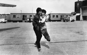Liverpool footballer David Johnson receives an enthusiastic embrace as the team depart Liverpool footballer David Johnson receives an enthusiastic embrace as the team depart