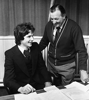 Liverpool manager Bob Paisley looks on as new defender Alan Hansen officially signs for Liverpool manager Bob Paisley looks on as new defender Alan Hansen officially signs for