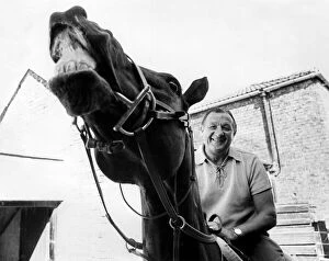 Images Dated 1st June 1976: Liverpool manager Bob Paisley pictured on a racehorse at a racing stables. June 1976