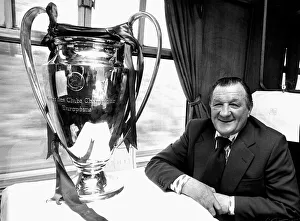 Liverpool manager Bob Paisley withthe European Cup trophy sitting on a train following Liverpool manager Bob Paisley withthe European Cup trophy sitting on a train following