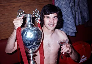 Liverpool player Peter Cormack celebrates winning the League Championship with the trophy Liverpool player Peter Cormack celebrates winning the League Championship with the trophy