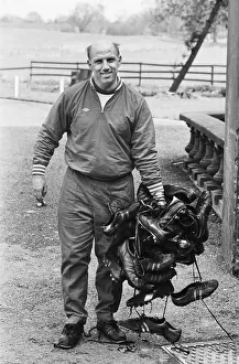Liverpool trainer Ronnie Moran holding a large collection of player' Liverpool trainer Ronnie Moran holding a large collection of player'