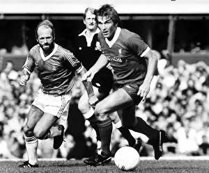 Liverpool's Kenny Dalglish shadowed by fellow Scot Archie Gemmill during their Liverpool's Kenny Dalglish shadowed by fellow Scot Archie Gemmill during their