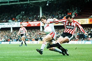 Liverpool's Peter Beardsley challenges Neil Ruddock of Southampton for the ball Liverpool's Peter Beardsley challenges Neil Ruddock of Southampton for the ball