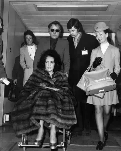 Liz Taylor and Richard Burton at Heathrow Airport today. December 1973 Liz Taylor and Richard Burton at Heathrow Airport today. December 1973