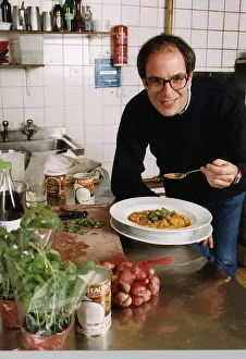 Lloyd Grossman TV Presenter of Master Chef in his wn kitchen trying out his own cooking Lloyd Grossman TV Presenter of Master Chef in his wn kitchen trying out his own cooking