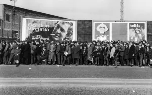 A long line of football fams queuing up to enter the stadium before a match in the North A long line of football fams queuing up to enter the stadium before a match in the North