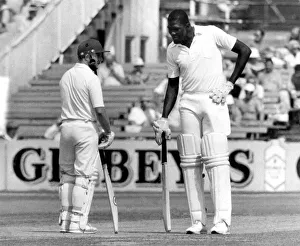The long and short of it. Joel Garner and Gard hold mid wicket conference. P006189. c The long and short of it. Joel Garner and Gard hold mid wicket conference. P006189. c