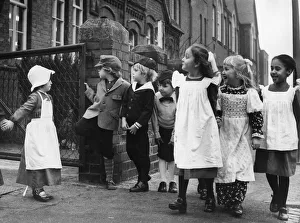 It looked like a scene from Dickens as these youngsters made their way to school in It looked like a scene from Dickens as these youngsters made their way to school in