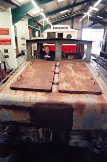 Lou Avis of Siemens Electronics takes a look at the 1909 Siemens engine being restored at Lou Avis of Siemens Electronics takes a look at the 1909 Siemens engine being restored at