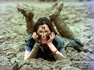 Images Dated 29th June 1997: Lucy Rock enjoying the mud at Glastonbury festival June 1997