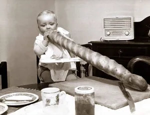 Lunch time! Little John Millar starts his huge sandwich - a large stick of french bread Lunch time! Little John Millar starts his huge sandwich - a large stick of french bread