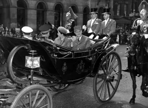 Madame and President Charles De Gaulle acknowledge the crowds cheers as they drive to Madame and President Charles De Gaulle acknowledge the crowds cheers as they drive to