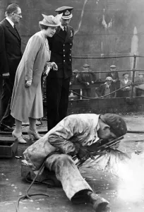 Their Majesties King George VI and Queen Elizabeth watch a welding process in a Tyneside Their Majesties King George VI and Queen Elizabeth watch a welding process in a Tyneside