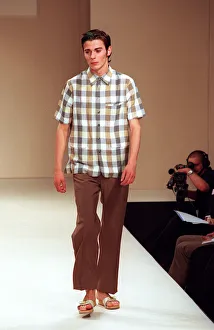Male model on catwalk in Designworks show for mens 1998 fashion week wearing check Male model on catwalk in Designworks show for mens 1998 fashion week wearing check