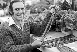 A man holding a selection of runner beans which are in a competition at Egton A man holding a selection of runner beans which are in a competition at Egton