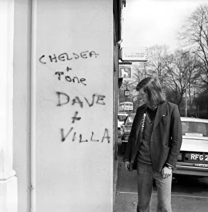 Man looking at a Graffiti covered wall after a football match February 1975 Man looking at a Graffiti covered wall after a football match February 1975