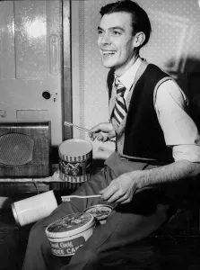 A man playing the drums using toothbrushes for drumsticks A man playing the drums using toothbrushes for drumsticks