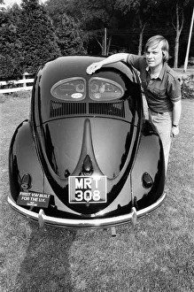 A man poses with a Volkswagen Beetle. 2nd June 1982 A man poses with a Volkswagen Beetle. 2nd June 1982