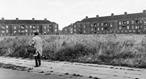 Images Dated 21st November 1973: Man walking down a street in the residential suburb f Speke in South Liverpool