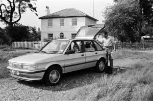 A man, woman and girl with a MG Maestro. 8th June 1983 A man, woman and girl with a MG Maestro. 8th June 1983