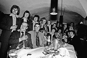 Manager Malcolm Allison with his Crystal Palace team relaxing in a bar drinking champagne Manager Malcolm Allison with his Crystal Palace team relaxing in a bar drinking champagne