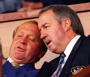 Manchester City Chairman Francis Lee talking with manager Frank Clarke as they sit in Manchester City Chairman Francis Lee talking with manager Frank Clarke as they sit in