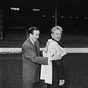 Manchester City new signing Denis Law with Ken Barnes trying his new shirt for size Manchester City new signing Denis Law with Ken Barnes trying his new shirt for size