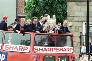Manchester United celebrate winning the treble as the jubilant team make their way Manchester United celebrate winning the treble as the jubilant team make their way
