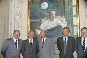 Images Dated 30th July 1991: Manchester United director Bobby Charlton (centre) standing in front of a painting of him