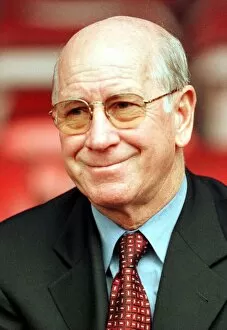 Images Dated 13th May 1999: Manchester United Director Bobby Charlton smiles as he enjoys watching a training session
