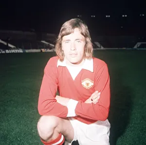 Manchester United footballer Sammy McIlroy poses during a pre season photocall at Old Manchester United footballer Sammy McIlroy poses during a pre season photocall at Old