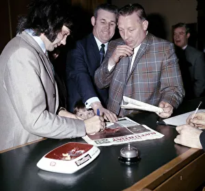 Manchester United and Northern Ireland footballer George Best signs autographs for a fan Manchester United and Northern Ireland footballer George Best signs autographs for a fan