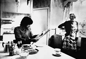 Manchester United's George Best enjoys breakfast as landlady Mary Fullaway looks Manchester United's George Best enjoys breakfast as landlady Mary Fullaway looks