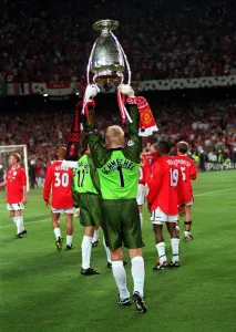 Manchester United's Peter Schmeichel holds the European Cup as he salutes the crowd Manchester United's Peter Schmeichel holds the European Cup as he salutes the crowd
