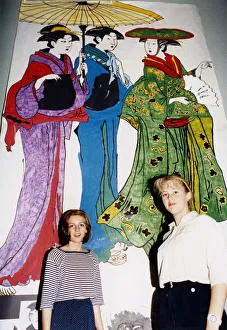 Mandy Barron, right, with Paula Conway, in front of large paintings go Japanese woman Mandy Barron, right, with Paula Conway, in front of large paintings go Japanese woman
