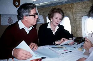 Margaret Thatcher MP prime Minister with Geoffrey Howe MP sit on a plane on their way to Margaret Thatcher MP prime Minister with Geoffrey Howe MP sit on a plane on their way to