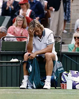 Martina Navratilova hangs her head in despair after Monica Seles had bundled her out of Martina Navratilova hangs her head in despair after Monica Seles had bundled her out of