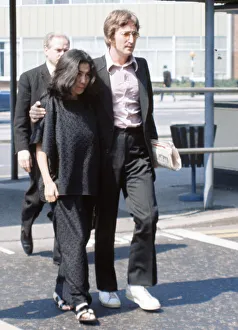 Former member of The Beatles pop group John Lennon with his wife Yoko Ono at Heathrow Former member of The Beatles pop group John Lennon with his wife Yoko Ono at Heathrow