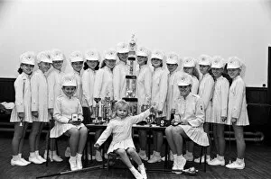 Images Dated 10th November 1987: Member of a recently formed majorette troop are literally in the limelight after winning