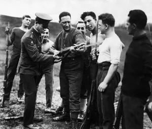 A member of the Royal Army Physical Training Corps gives Mr Jacob Epstein A member of the Royal Army Physical Training Corps gives Mr Jacob Epstein