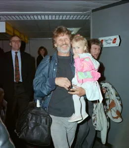 Members of The Highwaymen at Heathrow Airport. Kris Kristofferson and children Members of The Highwaymen at Heathrow Airport. Kris Kristofferson and children
