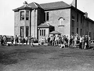 Members outside the clubhouse at Prestwick golf club Members outside the clubhouse at Prestwick golf club