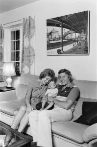 Michael Aspel pictured at home with his wife Lizzie Power and their son. September 1982 Michael Aspel pictured at home with his wife Lizzie Power and their son. September 1982