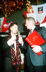 Michael Aspel TV Presenter of This is your Life surprising Nigel Kennedy holding red book Michael Aspel TV Presenter of This is your Life surprising Nigel Kennedy holding red book