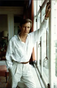 Michael York actor standing next to window - August 1989 Michael York actor standing next to window - August 1989