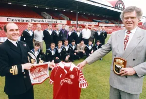 Middlesbrough's chairman, Colin Henderson, presents a set of shirts Middlesbrough's chairman, Colin Henderson, presents a set of shirts