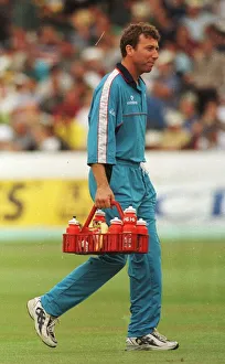 Mike Atherton of England and Lancashire August 1998 carries the drinks holder Mike Atherton of England and Lancashire August 1998 carries the drinks holder