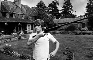 Mike Oldfield muscian at home holding a gun Mike Oldfield muscian at home holding a gun