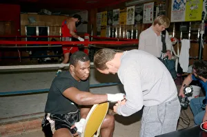 Mike Tyson in his training camp with trainer Kevin Rooney ahead of his bout with James Mike Tyson in his training camp with trainer Kevin Rooney ahead of his bout with James